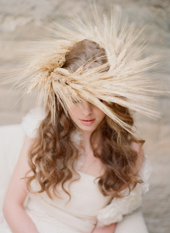 Woman with wheat crown, long wavy hair, elegant