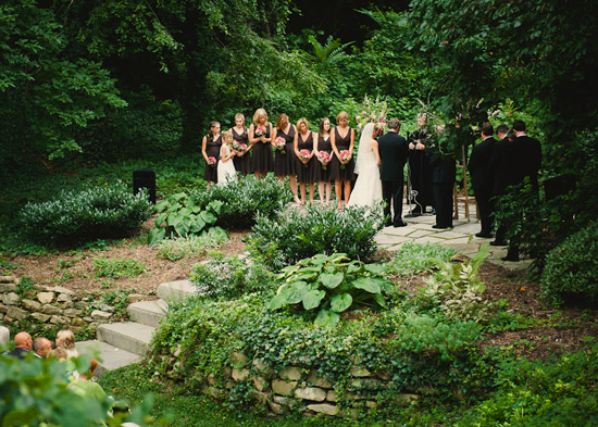 Garden wedding ceremony with bride and bridesmaids