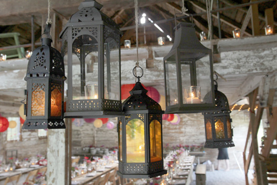Hanging decorative lanterns at rustic barn wedding venue