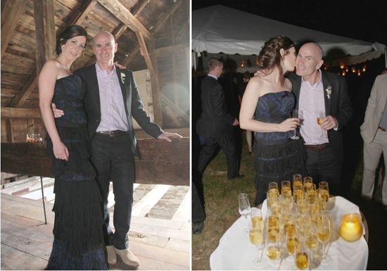 Wedding guests pose for photos with champagne at barn venue
