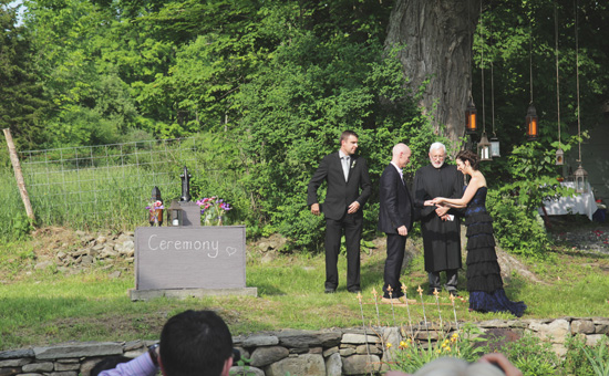 Outdoor wedding ceremony with bride and groom exchanging rings