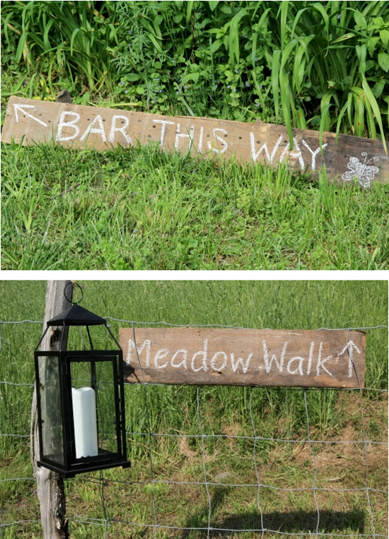 Rustic signs to the bar and meadow walk outdoor party