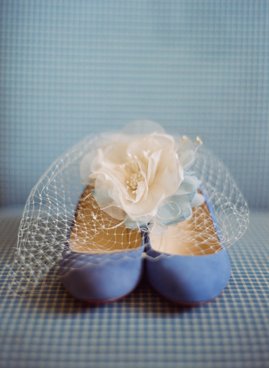 Pretty light blue shoes with a flower and veil