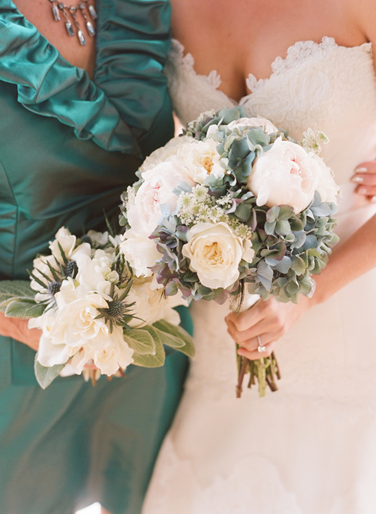 Bride holds peony and hydrangea wedding bouquet