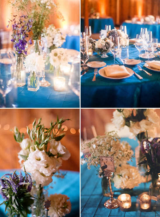 Teal wedding reception tables with floral centerpieces