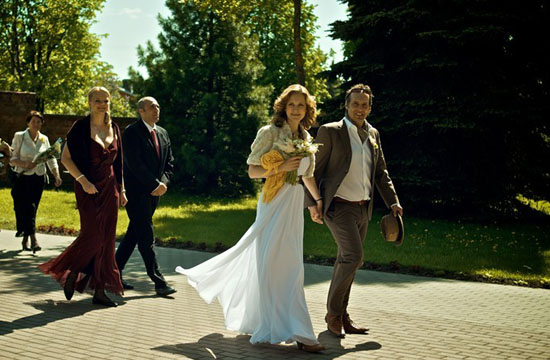 Happy bride and groom walking down the aisle