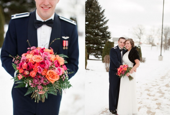 Bright coral and pink wedding bouquet held by groom in Air Force uniform