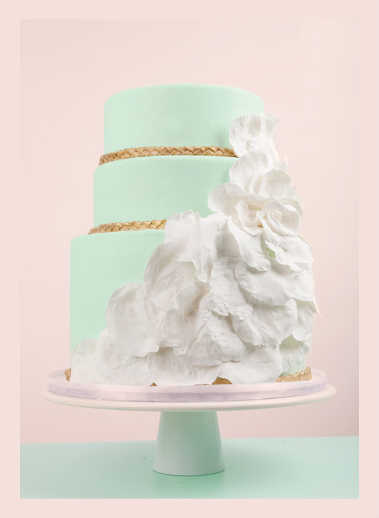 Mint green wedding cake with white flower details