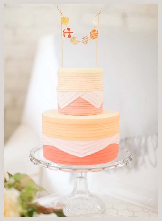 Pretty tiered cake with pastel colors and decorations