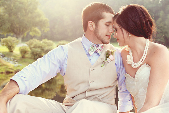 Romantic wedding couple embracing outdoors