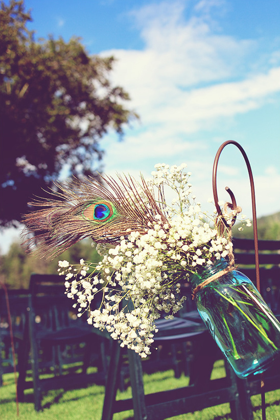 Peacock feather and baby's breath wedding decor