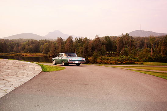 Vintage car on scenic country road