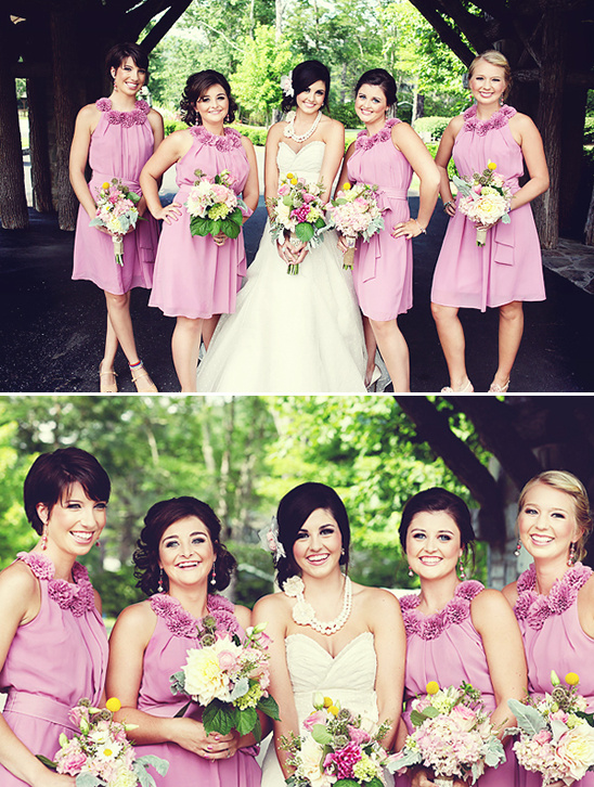Bridesmaids in lilac dresses pose for a wedding photo