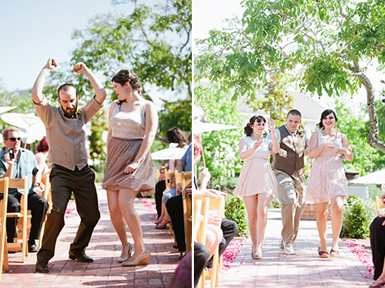 Happy wedding guests joyfully dancing down the aisle