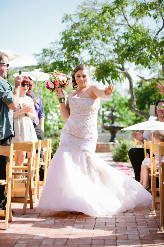 Bride walking down aisle in wedding dress