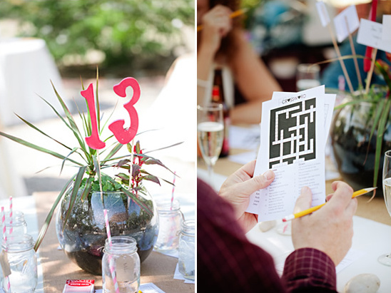 Table number thirteen with a plant and crossword puzzle