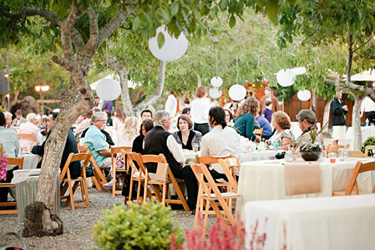 Outdoor wedding reception under trees