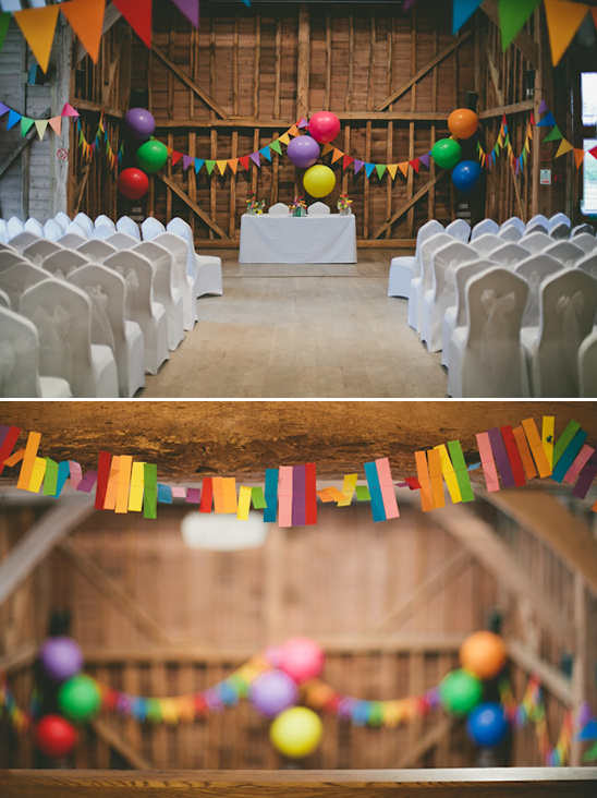 Wedding venue decorated with balloons and colorful garlands