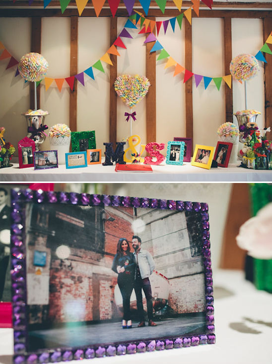 Wedding reception decorations with photo frames and colorful banners