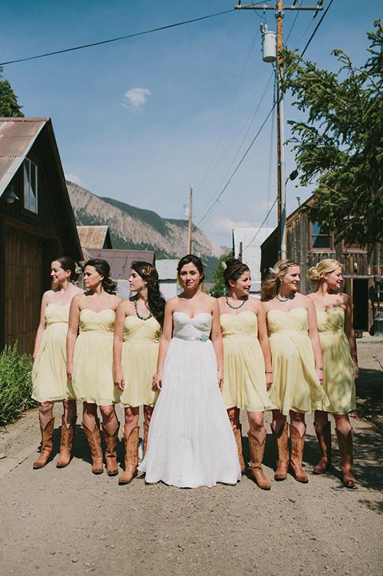 Bride and bridesmaids wearing boots on a rustic wedding day