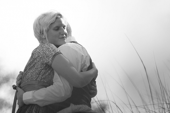 Woman embracing a man with loving embrace in black and white