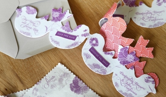 Wedding invitations in a bird shape with floral pattern