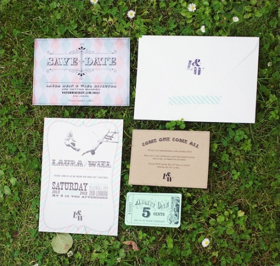 Wedding invitations with vintage circus theme laid on grass