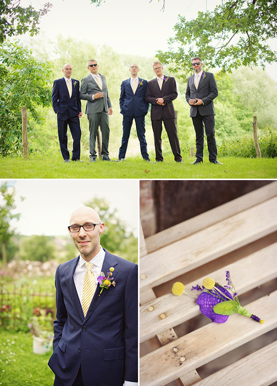 Stylish groomsmen in suits posing for a wedding photo