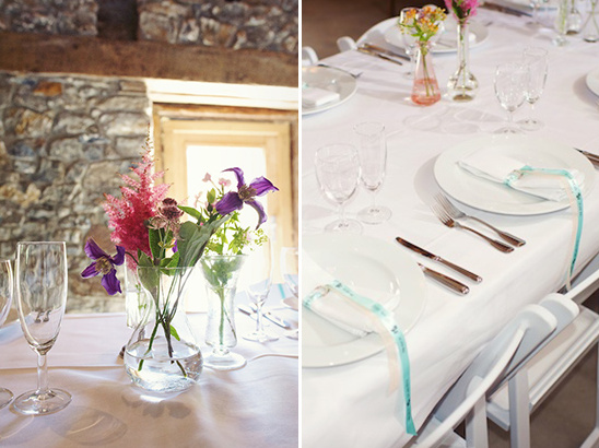 Elegant wedding table setting with floral centerpieces and white linen