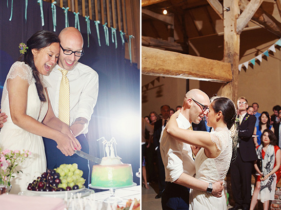 Newlyweds cutting cake at wedding reception in joyful moment