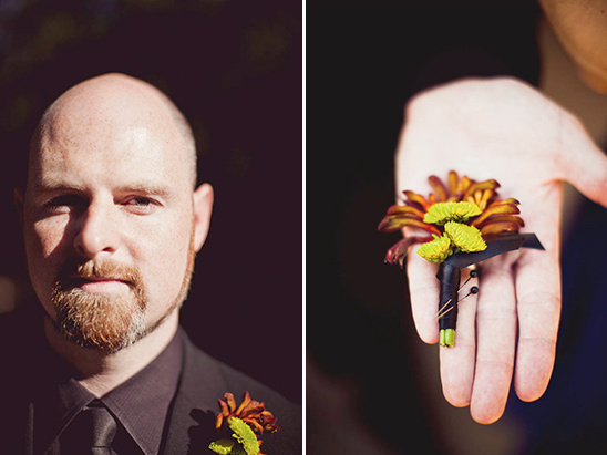 Groom with a beard and boutonniere, holding flower display