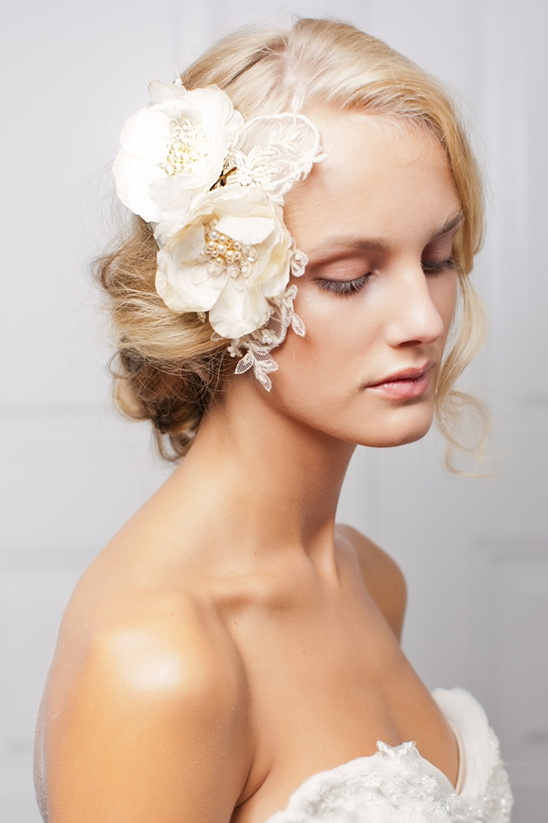 Elegant bride with floral hairpiece and bridal gown