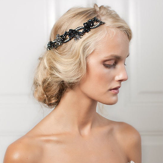 Elegant woman with curly blonde hair and black headband