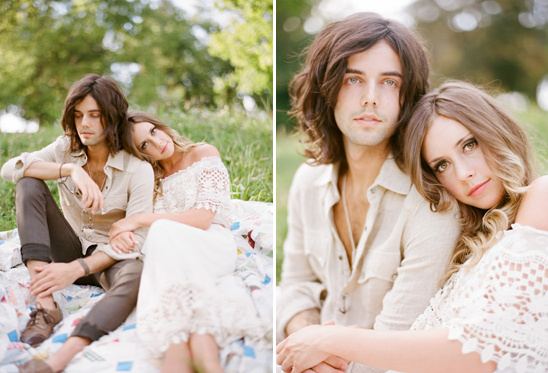Romantic couple in boho style poses in a peaceful grassy field