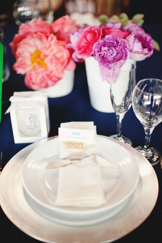Elegant table setting with vibrant floral arrangement centerpiece