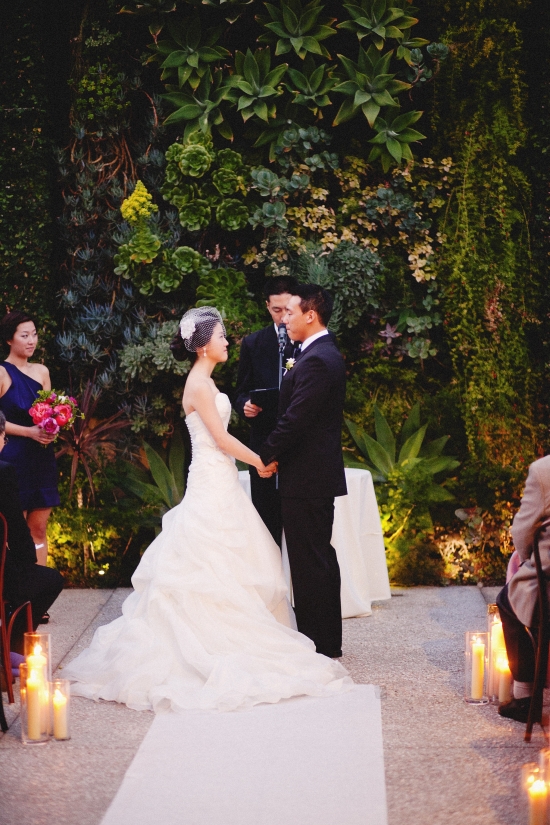 Couple exchanging vows in a romantic garden wedding ceremony
