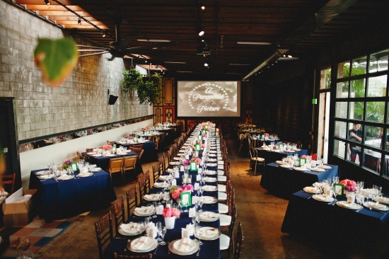 Elegant dinner party setup with a classic film backdrop