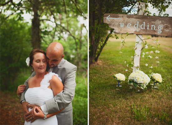 Wedding couple embraces near wedding sign, romantic outdoors