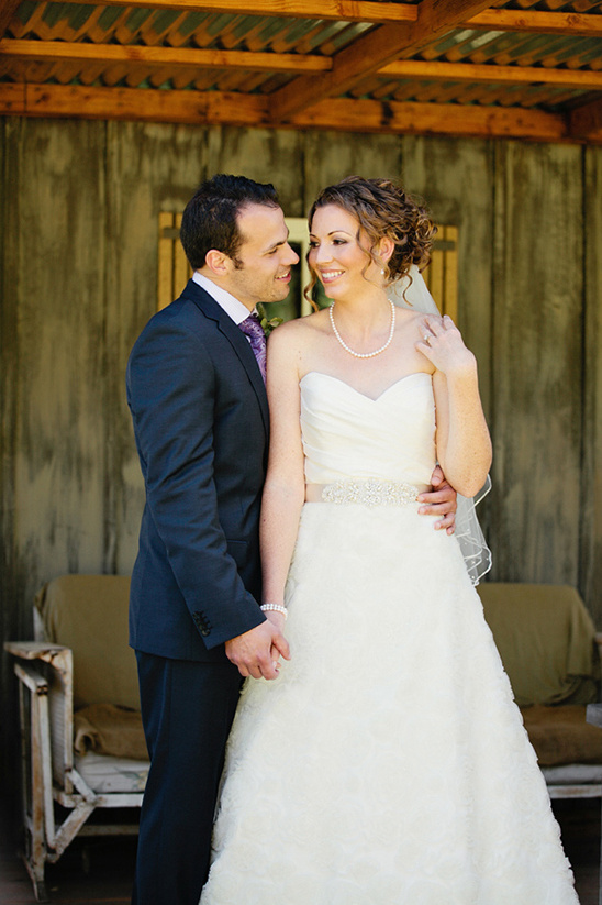Newlyweds share a loving glance at their wedding