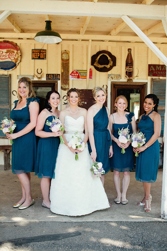 Bride and bridesmaids in teal dresses outdoor wedding