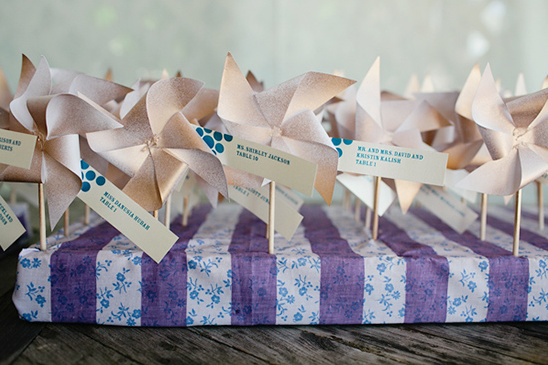 Wedding place cards with paper pinwheels holders