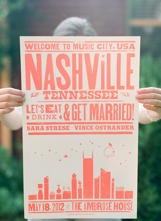 Nashville wedding poster held by a person with orange text design