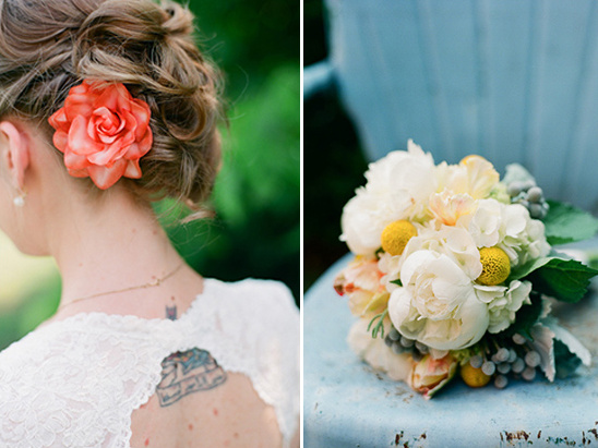 Bride with a rose in her hair, lace dress and a floral bouquet