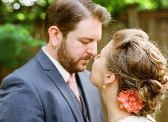 Romantic moment of a couple about to kiss at a wedding