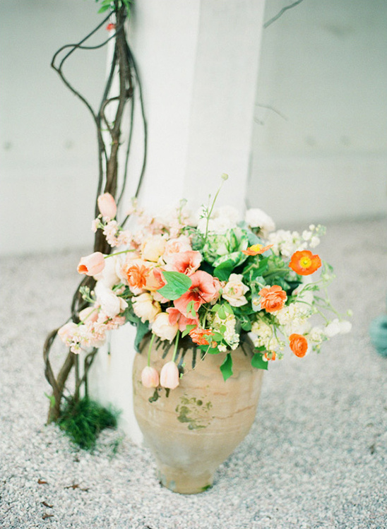 Floral arrangement in a rustic vase with colorful flowers, romantic