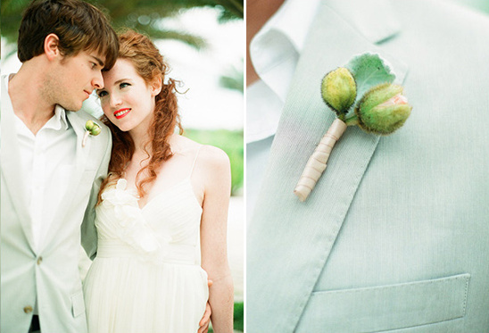 Romantic couple at a wedding with flower boutonniere on a suit