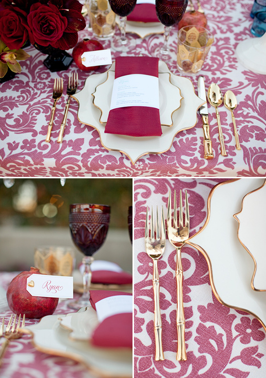 Elegant burgundy dinnerware, gold cutlery