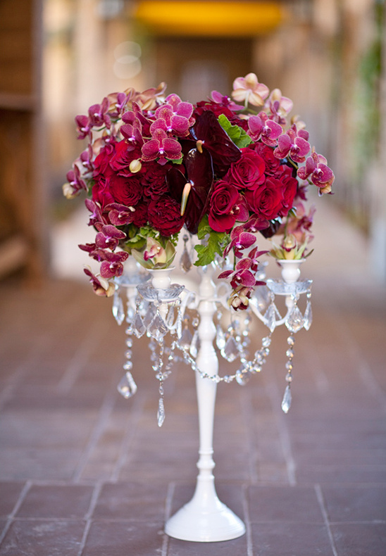 Elegant floral centerpiece with red roses and orchids