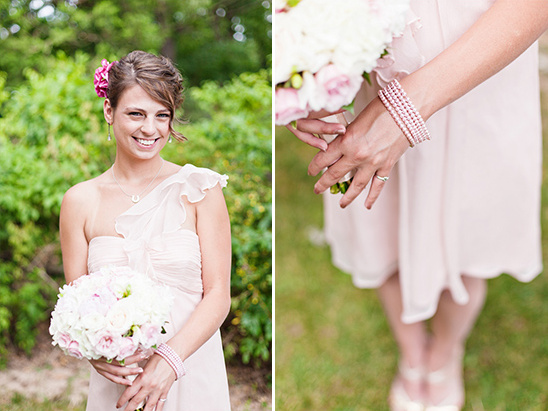 Woman in light pink dress with flowers and jewelry