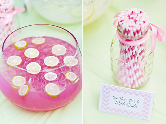 Pink punch with lime slices and pink striped straws